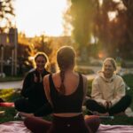 여성 건강관리, 일상 속 작은 변화로 큰 차이를 만든다 a group of people sitting on top of a lush green field